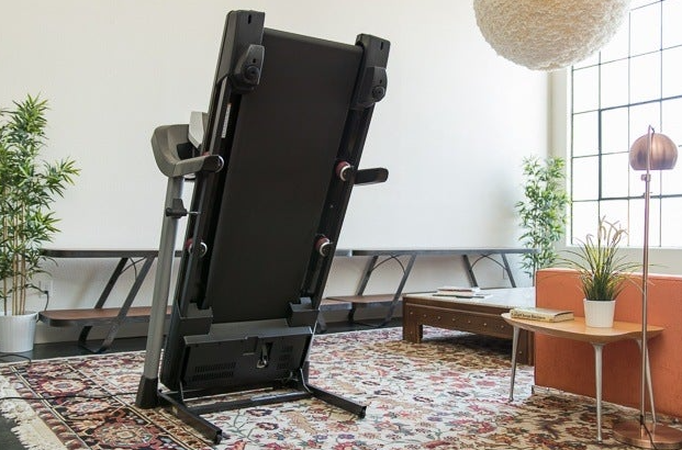 A folded treadmill in living room 