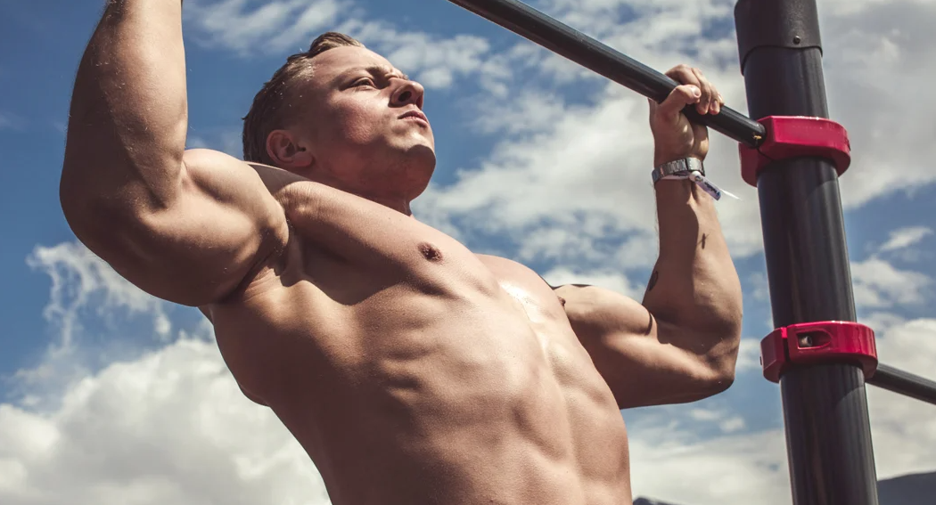 50 pull ups a day will give you compound movement which benefits more than one muscle group